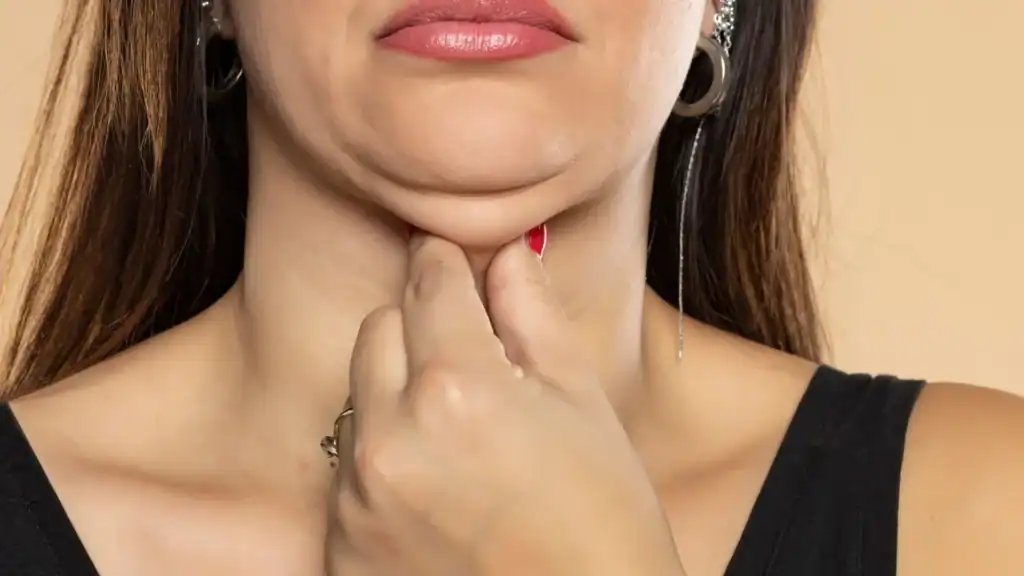 An image of a woman with double chin, sad, worried : Non Surgical Double Chin Removal Treatment in Uckfield, UK